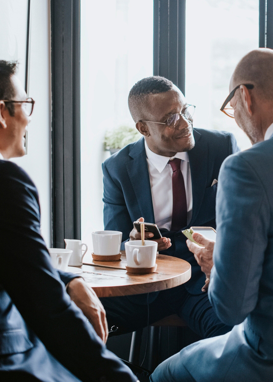 Business people in a cafe discussing business